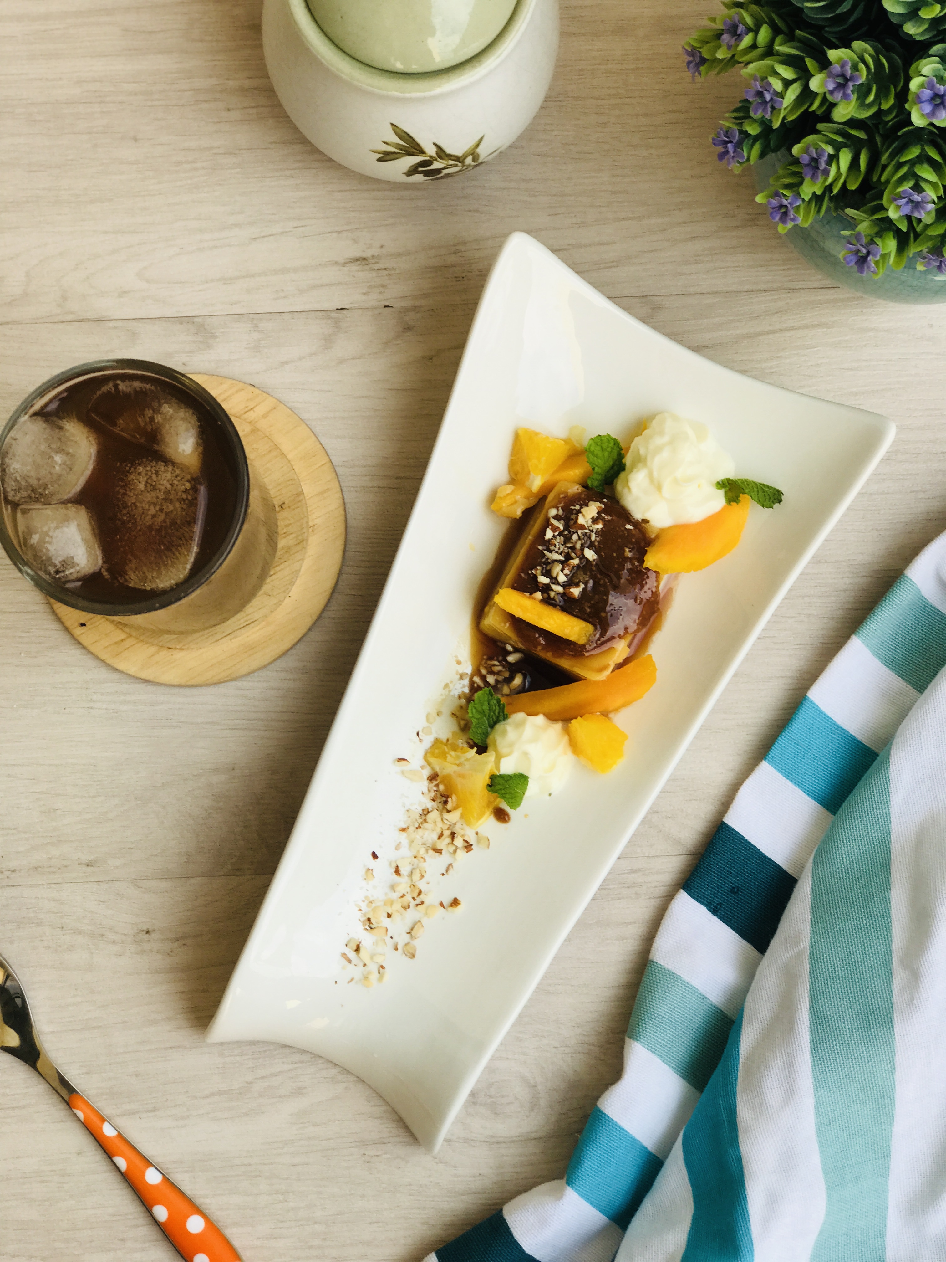Toffee Creme Bruleé with fresh mangoes and oranges paired with Iced ...